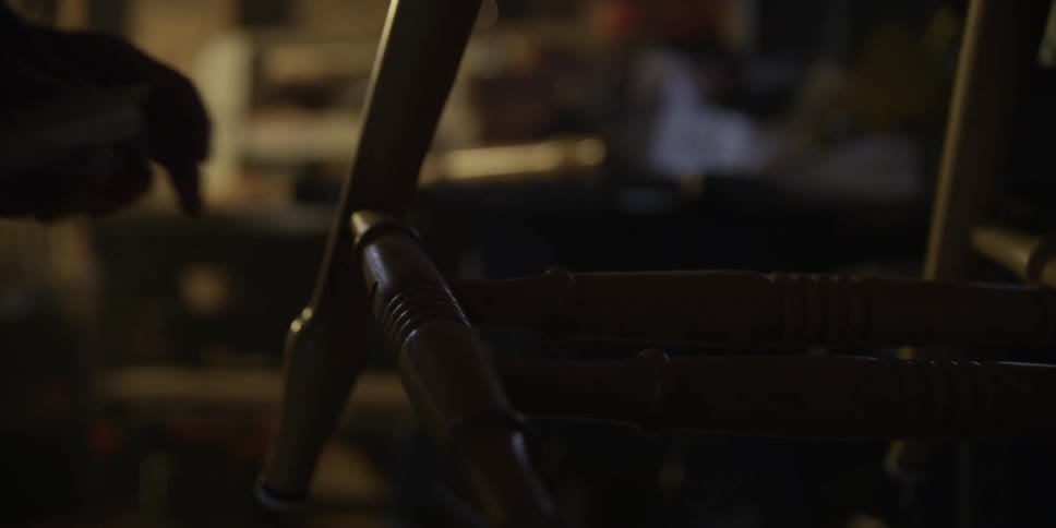 A man works on a chair