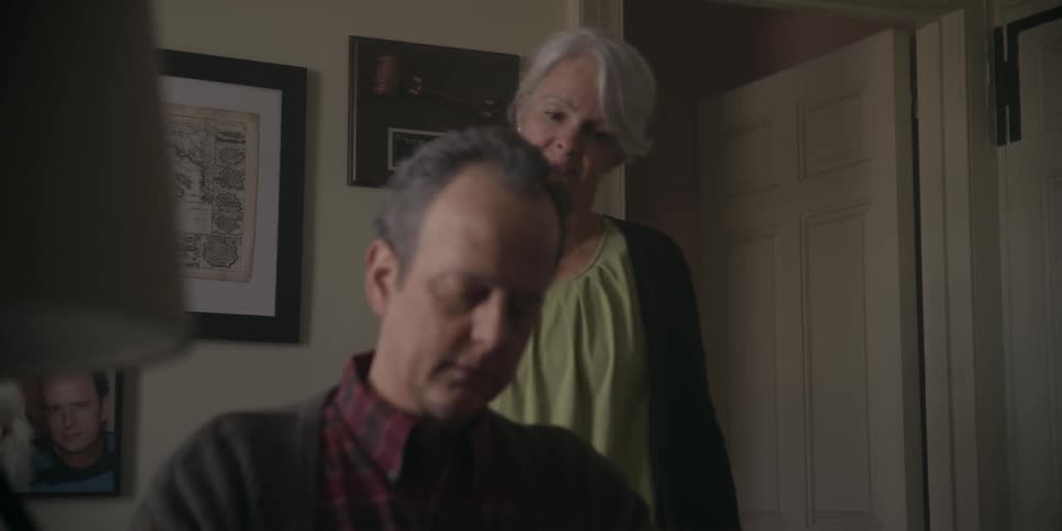 A couple is talking inside their home