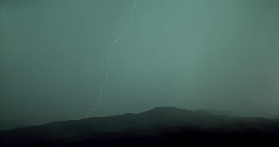 Lightning flashes across the sky