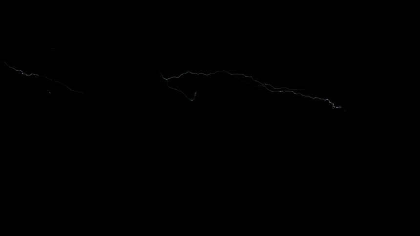 Lightning bolts flash across a black sky