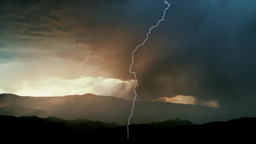 A large lightning bolt shoots from the storm clouds