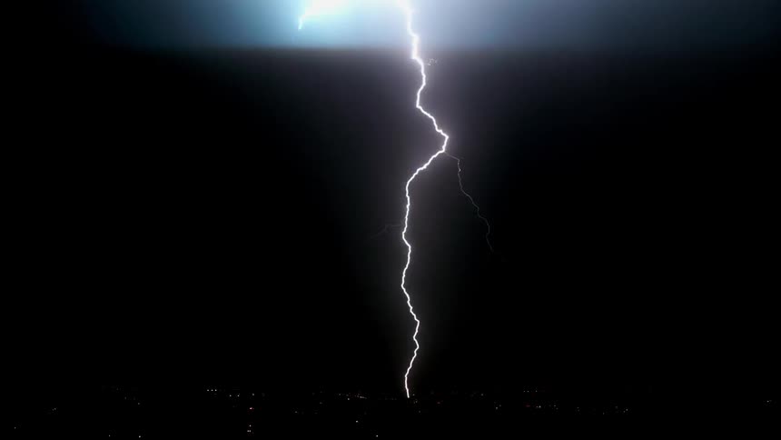 Lightning streaks across night sky