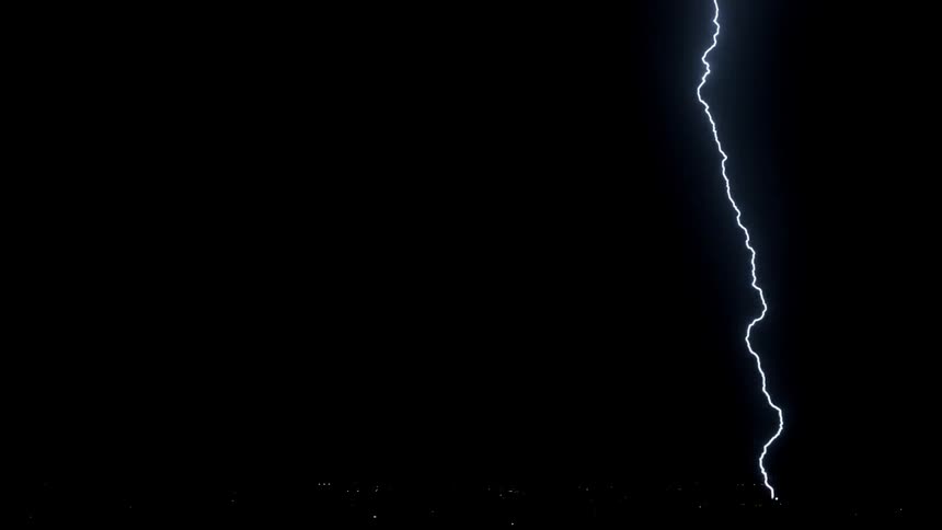 Lightning flashes in the dark sky