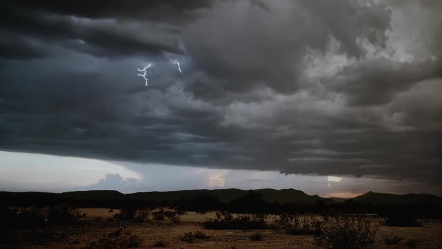 Lightning flashes in a cloudy sky