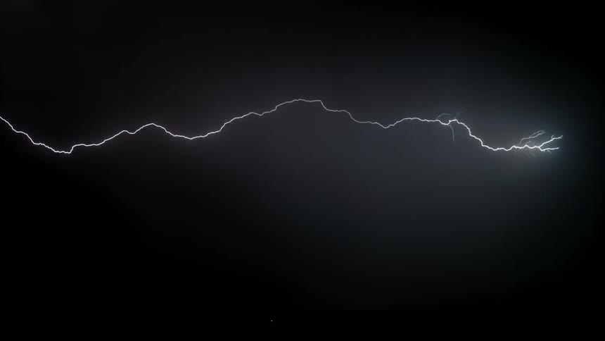 The lightning flashes in the night sky