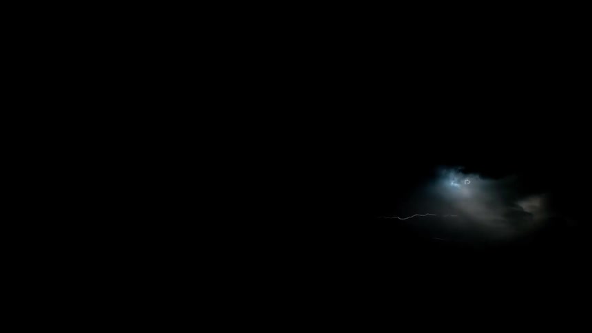 Lightning flashes in the dark night sky