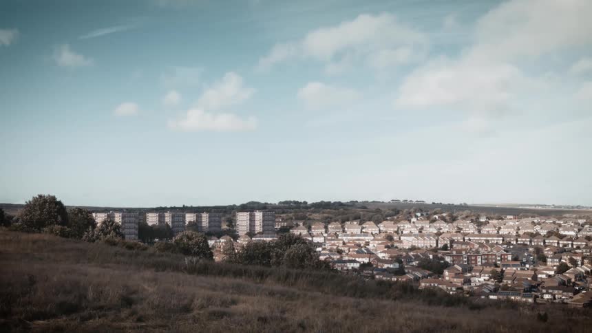 Large city sits under a blue sky