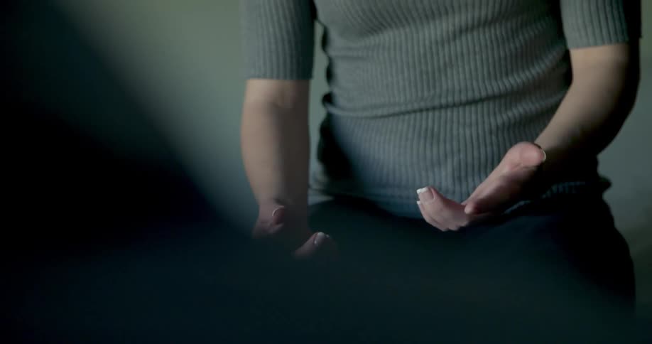 A woman motions with her hands