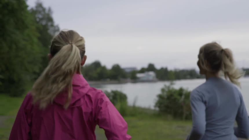 Athletic women wear colorful sports jackets while practicing a daily cardio workout routine.