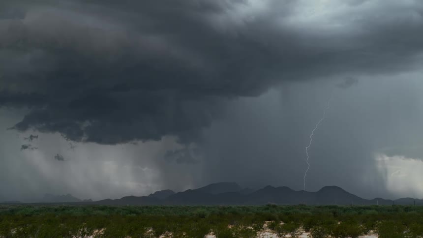Lightning bolts flash in the dark sky