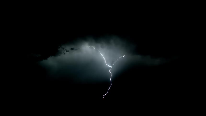 The thick clouds flash with lightning at night