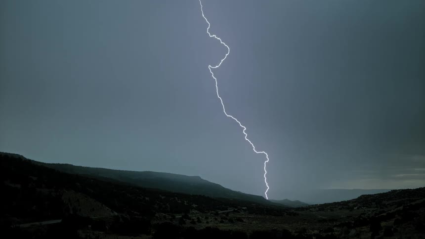Lightning bolts flash across the sky