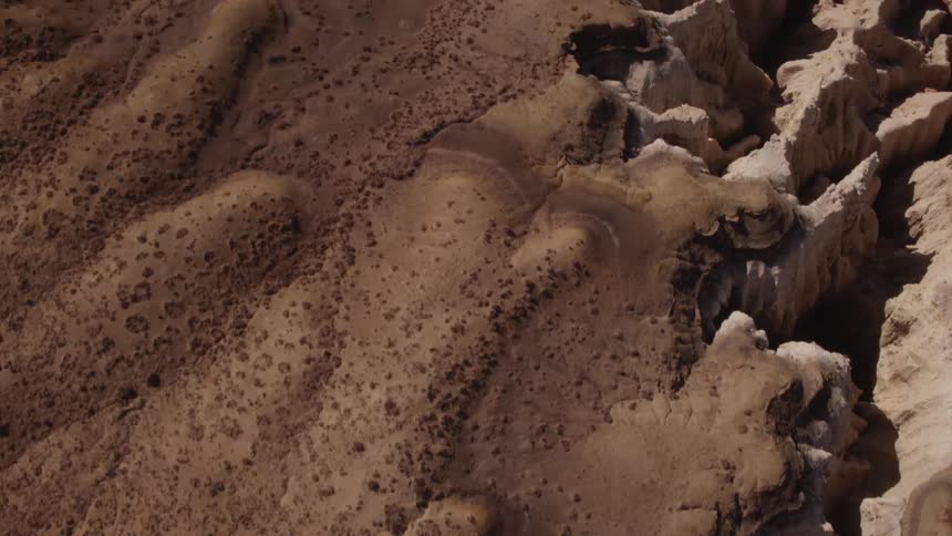 Rocky cliffs cover a desert landscape