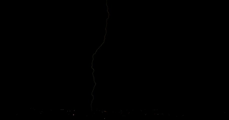 Lightning flashes in the night sky