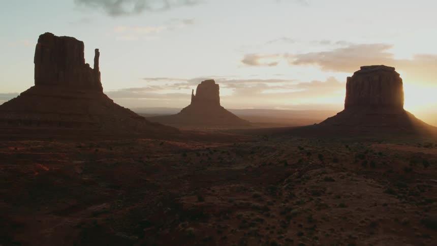 The tall rocks ahead cover the canyon at dawn