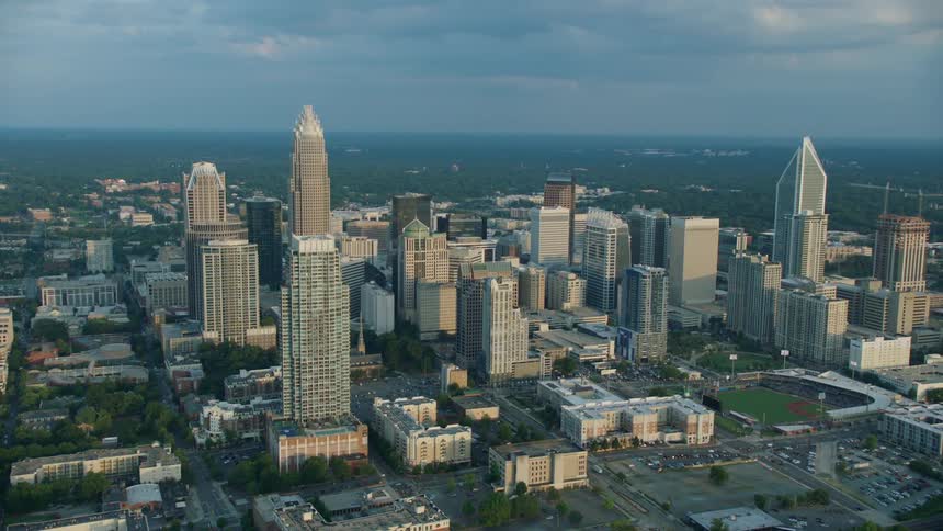 The city is full of tall buildings on a cloudy day