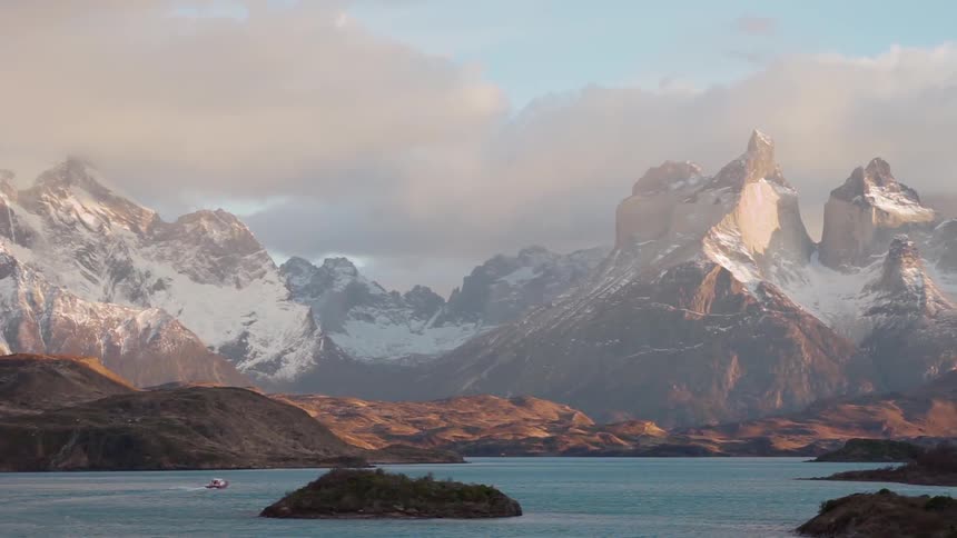 Snowy mountains surround a lake