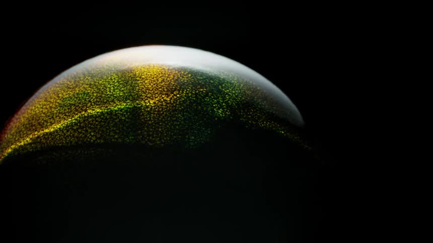 Light shines on a colorful sphere