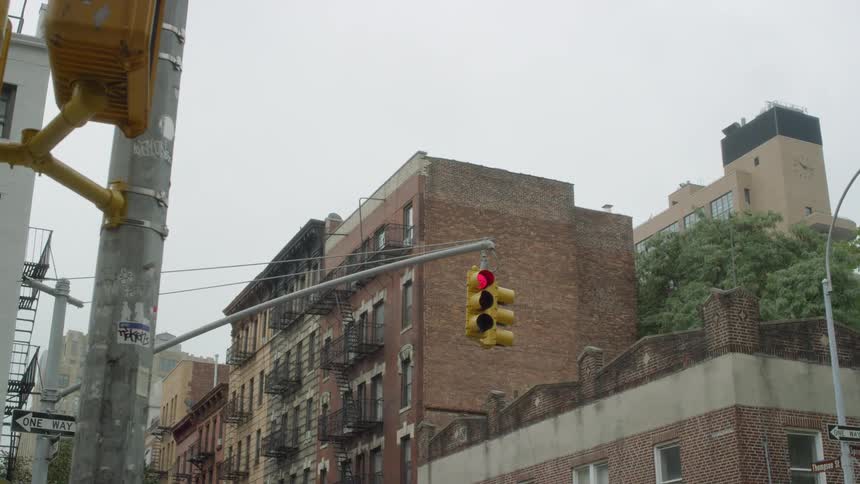 A traffic light is red in a city