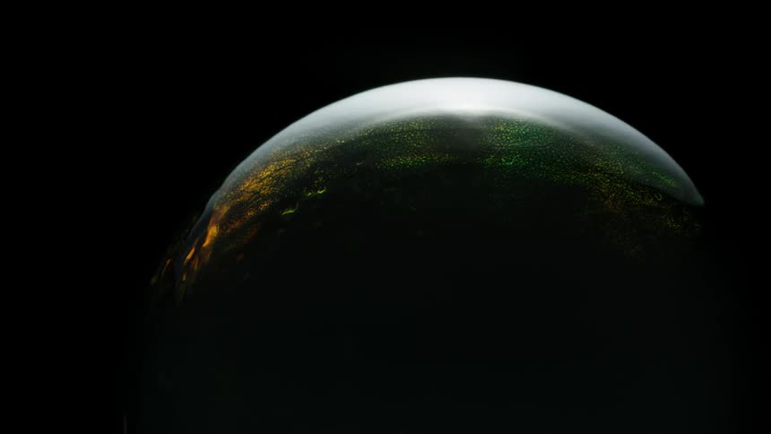 Color and light are fluorescing on a convex surface