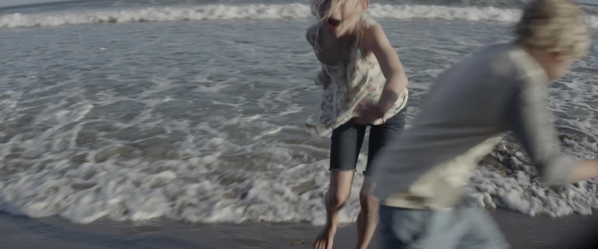 The waves crash against the shore
