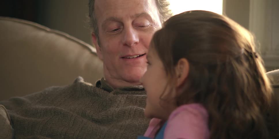 A man is talking to his daughter