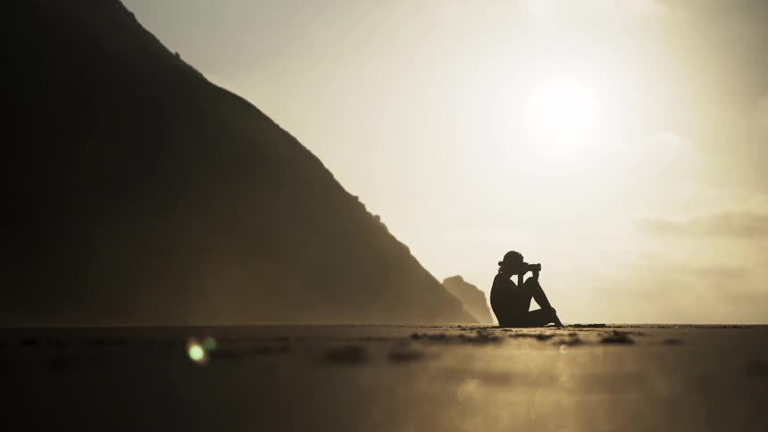 A female photographer on the beach