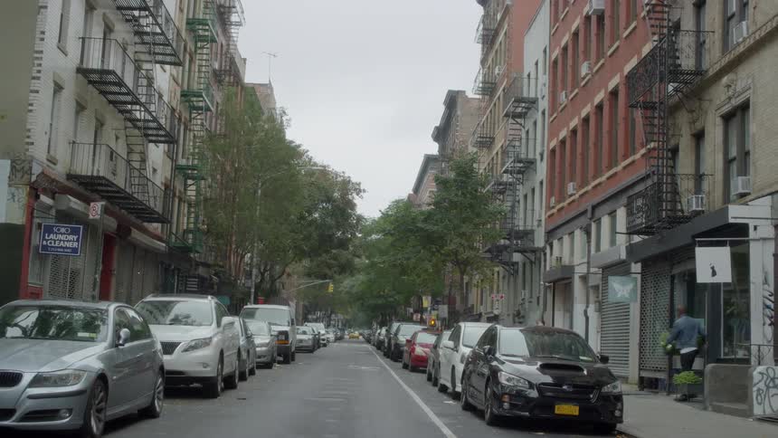 Cars are parked on a city street