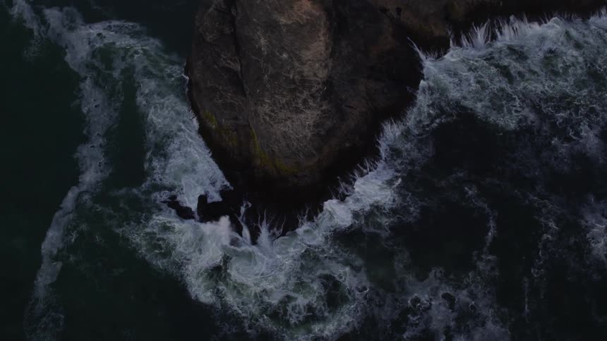 Ocean waves crash into a rocky coast
