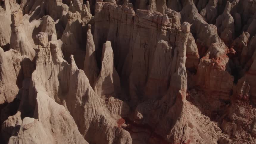Rock formations stand in a desert