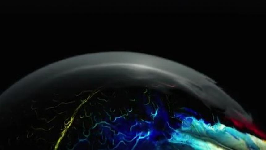 Color and light are fluorescing on a reflective surface