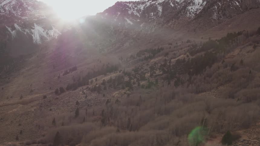 Sunlight shines over snowy mountains