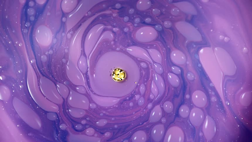 The purple paint spins and mixes