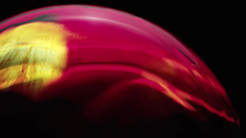 A globe has flashing yellow and red lights