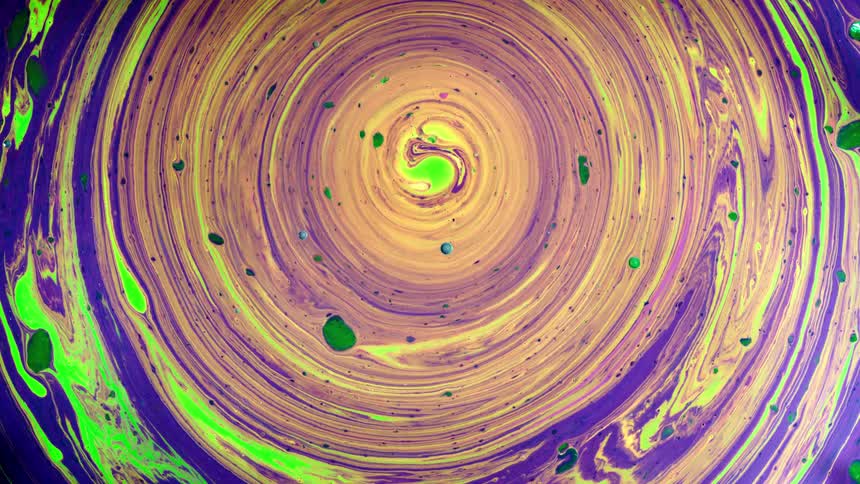 Colorful paint swirls and flows