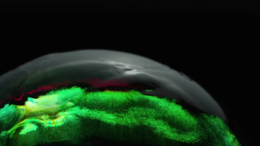 An abstract of green liquid sloshing around