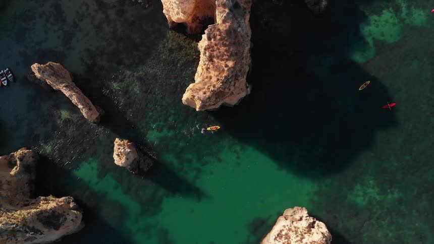 People kayak on the ocean