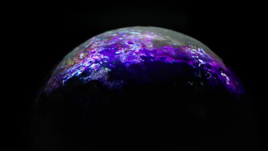 A globe has glowing lights flashing