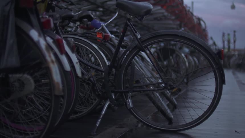 A row of bicycles are parked outside