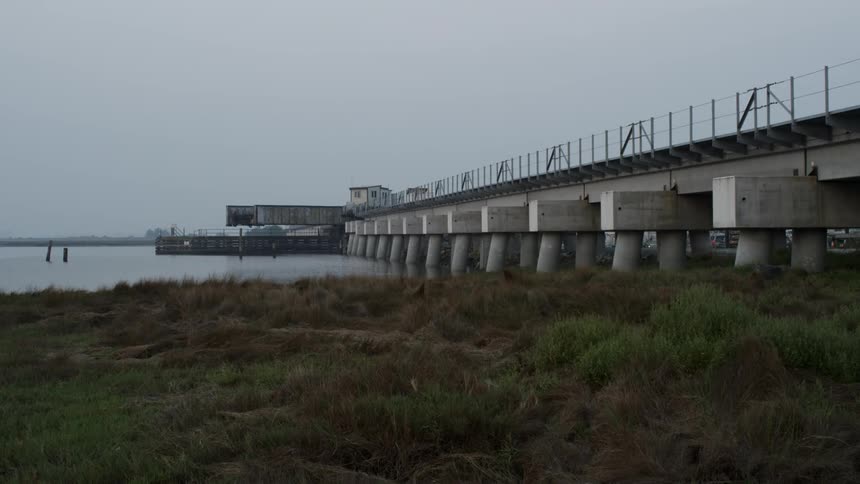 A bridge is moving to allow boats to pass
