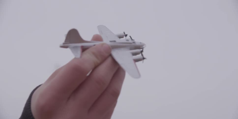 A boy plays with a toy