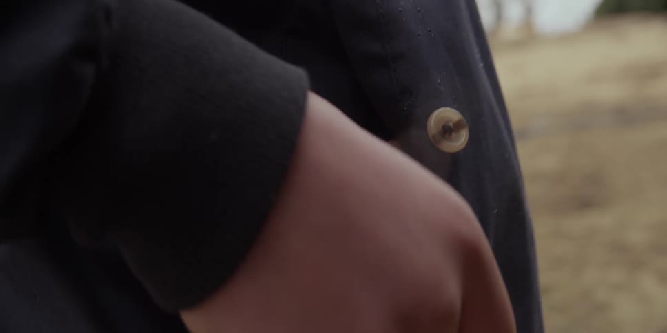 Person puts a toy airplane in his shirt