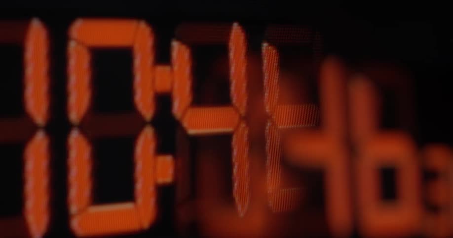 A timer with large red numbers counts up minutes
