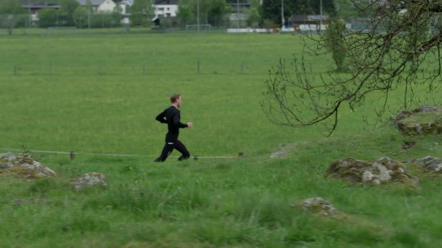 A man jogs on a rural road