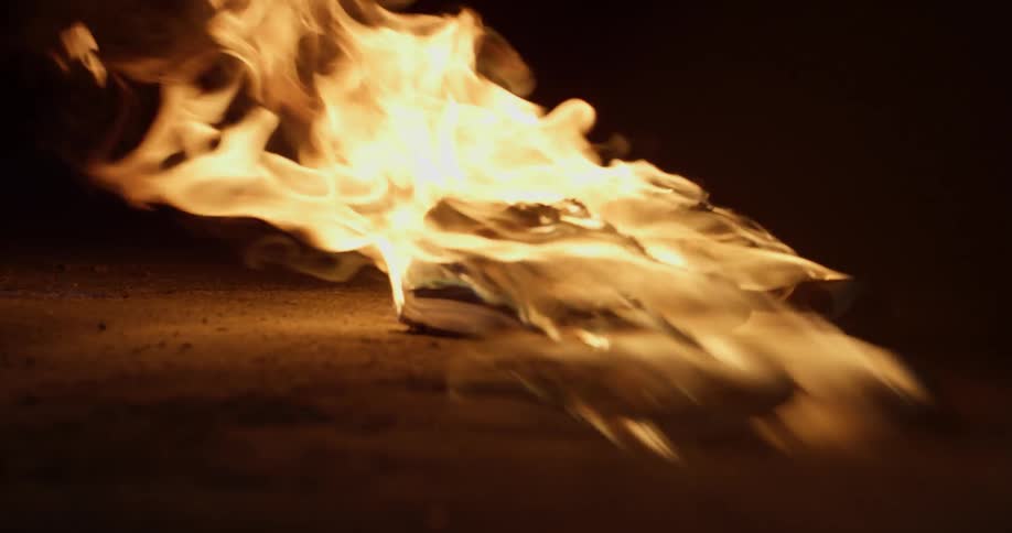 The fire is burning the wood at night