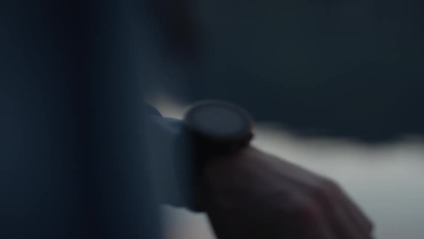 A watch is on a person's hand