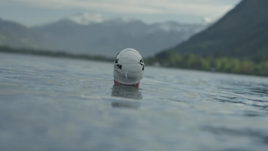 A swimmer floats in the water