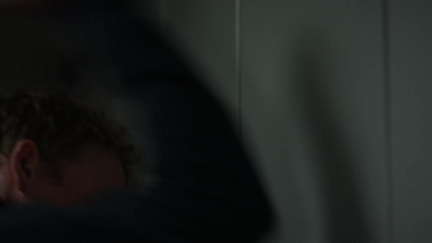 A man slams a wall with his fist