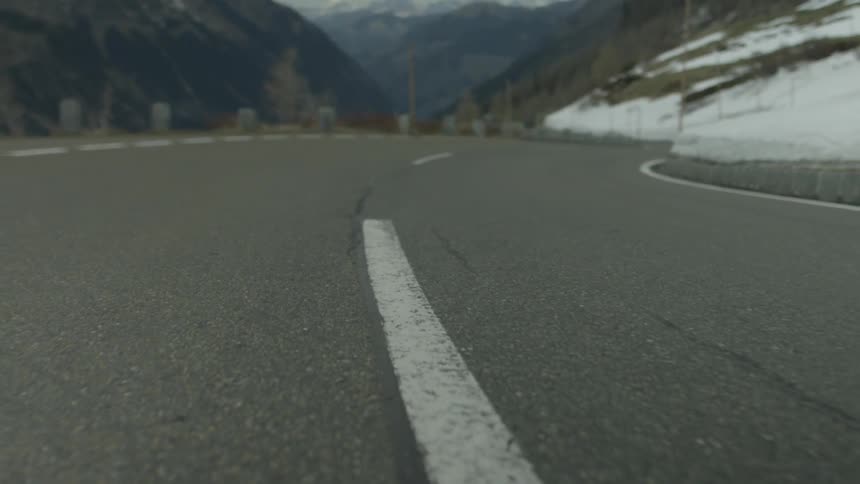 The small road runs the side of the mountain