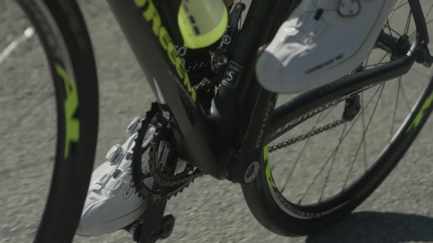 A bicyclist pedals on the road